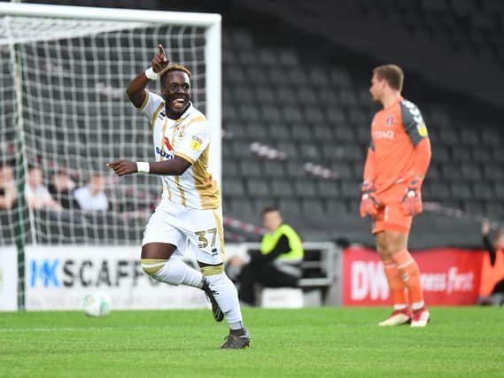 Dylan Asonganyi fires MK Dons into the lead