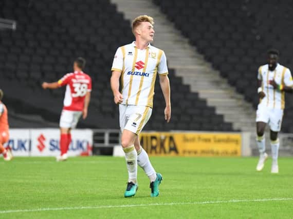 Ryan Watson celebrates scoring his first MK Dons goal