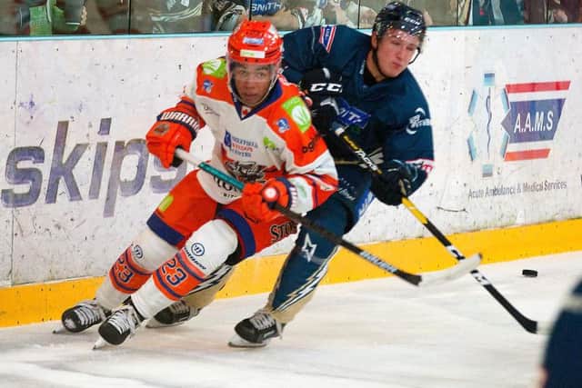 Georgs Golovkovs battles for the puck at Planet Ice