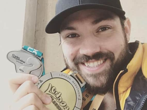 Sam with his marathon medal