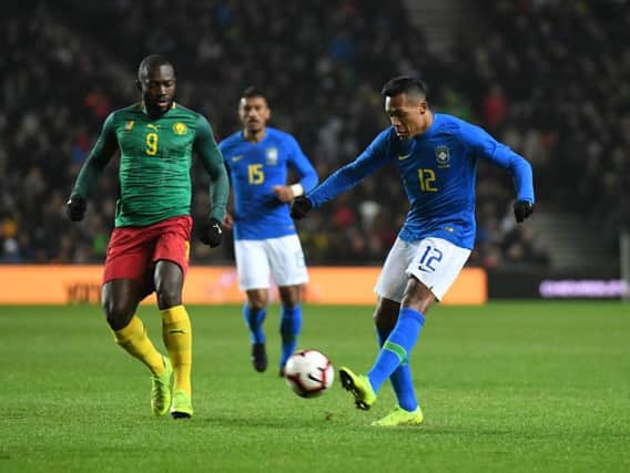 Alex Sandro gets a shot away for Brazil