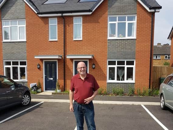 Nigel Long outside a newly-built council house, which is yet to become 'non-decent'