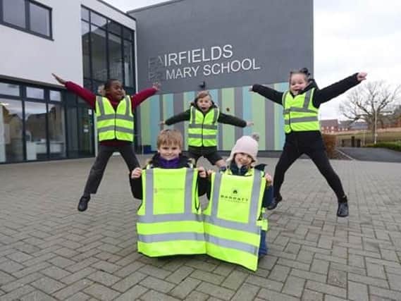 Children with their new safety jackets