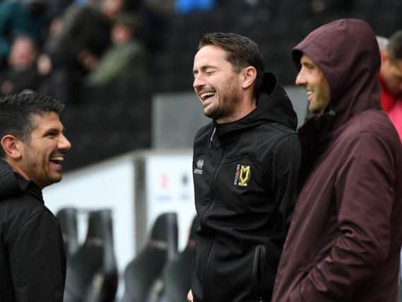 Paul Tisdale (right) shares a joke with Danny Butterfield (left) and Matt Oakley (centre)