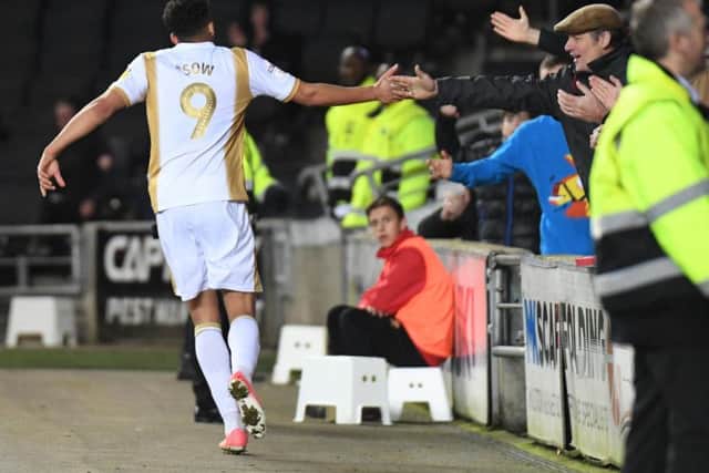 Osman Sow celebrates his goal against Cambridge
