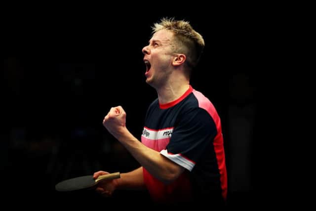 Andrew Baggaley celebrates his World Ping Pong title win