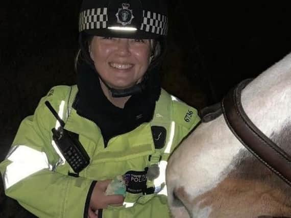 The officer with her horse AND lost budgie