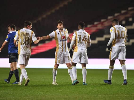 Russell Martin celebrates with his MK Dons team-mates