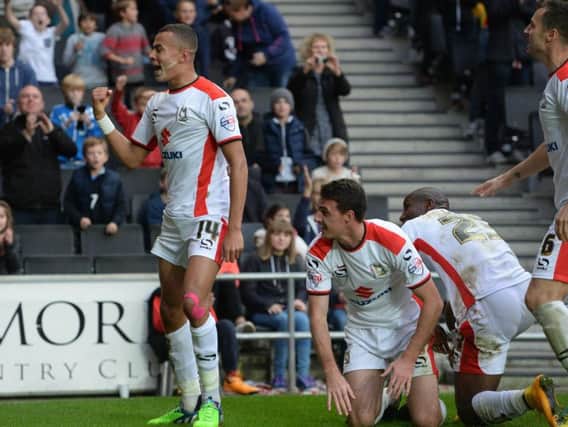 Dele Alli celebrates his goal against Swindon in 2014