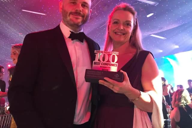 Oakman Inns' Ops Director Alex Ford & HR Director Jill Scatchard celebrate at Sunday Times Best Companies to Work For 2019