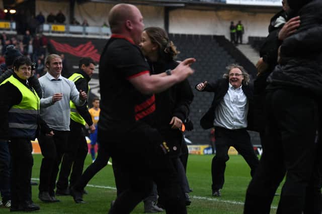 Pete Winkelman celebrates on the pitch at the full time whistle