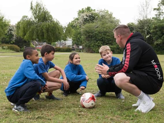 MK Dons coach Jamie Atkinson working with Buckingham Primary School pupils