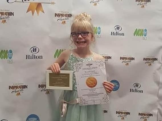 Amazing Miyla with her award