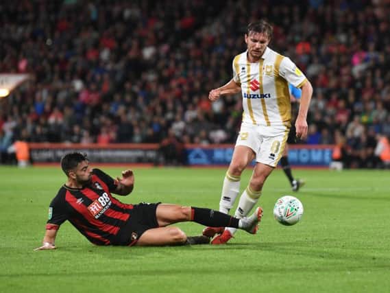 Dons were beaten by Bournemouth in the Carabao Cup second round last season
