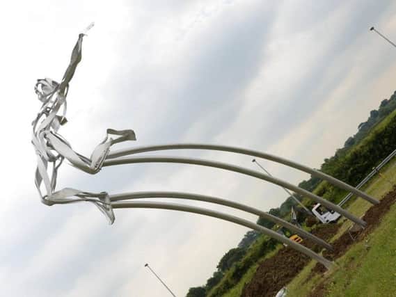 Greg Rutherford's statue on the A421 in Milton Keynes