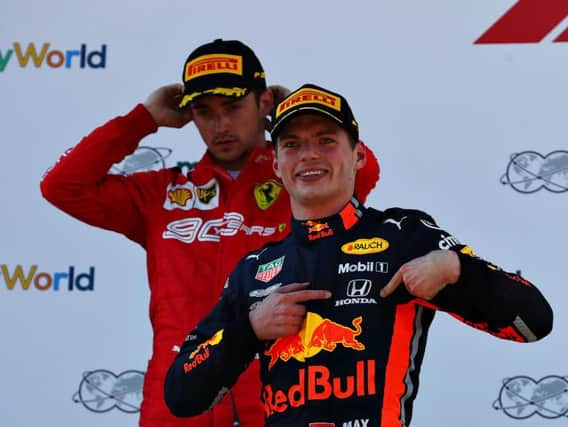 Verstappen celebrates in front of Leclerc on the podium