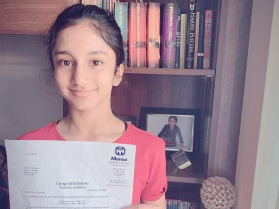 Moksha Sunkara with her IQ certificate