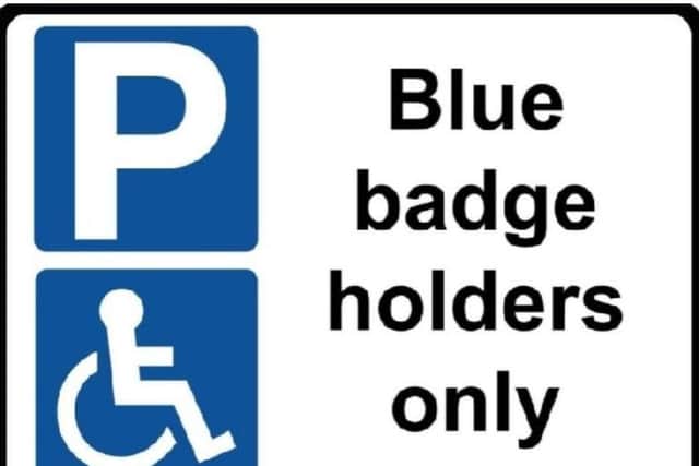 Blue badge holders sign
