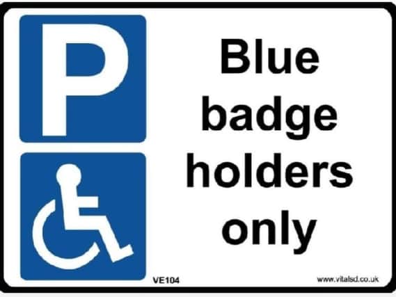 Blue badge holders sign