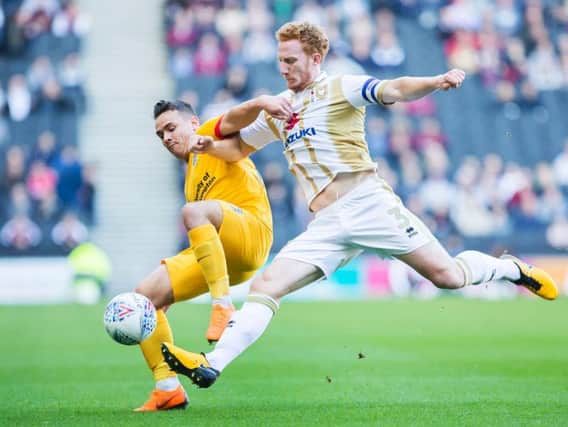 Dean Lewington in action against Northampton last season