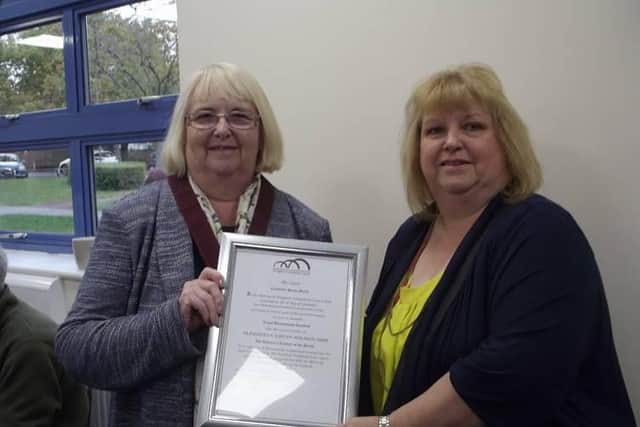 Kevin's wife pictured accepting the award from Cllr Sue Smith, leader of Woughton Community Council