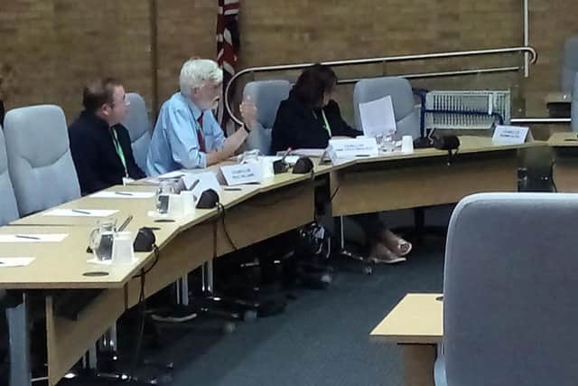 Cllr Norman Miles (centre) speaking in the council chamber