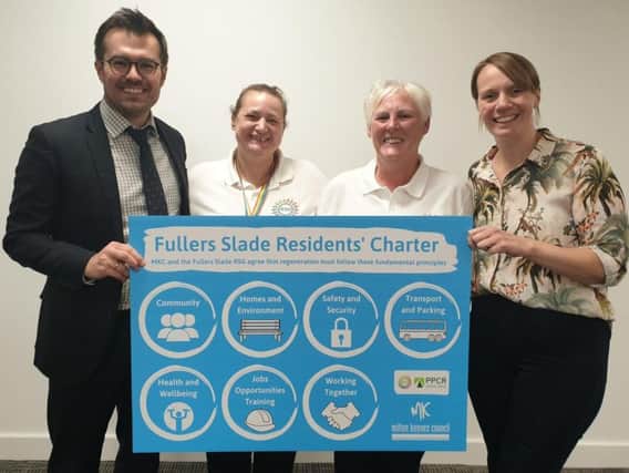 Cllr Hannah ONeil (Deputy Leader), right, and Rob Middleton (Cabinet Member for Finance and Resources), left, flanking members of the Fullers Slade Residents Steering Group