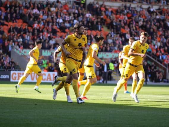 Russell Martin celebrates the opener against Blackpool