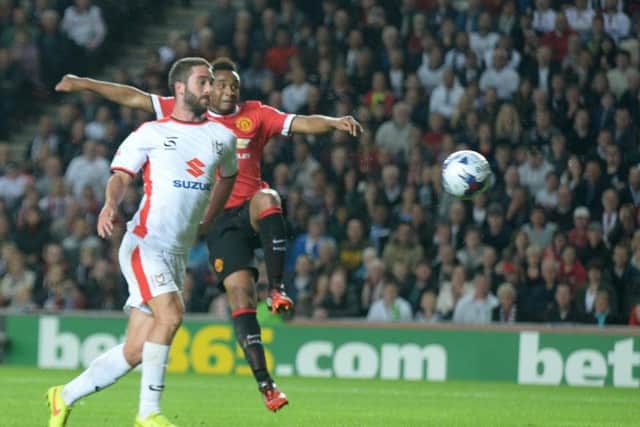 Will Grigg scored a brace against United in 2014, including this with his chest