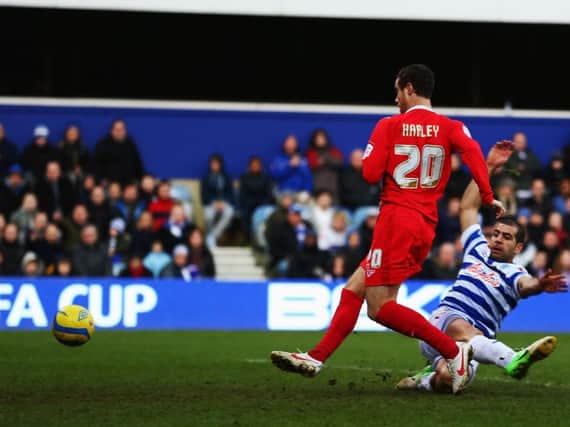 Ryan Harley scores for Dons in the FA Cup win over QPR in 2013.