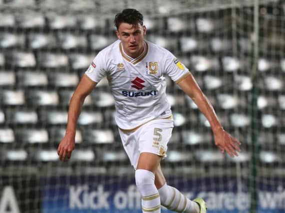 Regan Poole in action for MK Dons