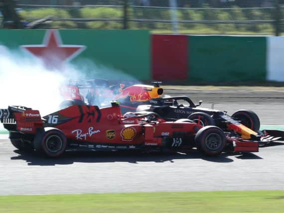 Max Verstappen clashes with Ferrari's Charles Leclerc in Japan