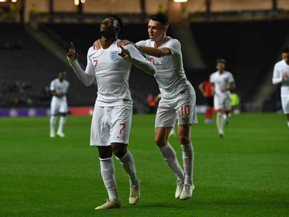 Callum Hudson-Odoi celebrates his stunning second goal with England Under-21 team-mate Phil Foden (Picture: Jane Russell)