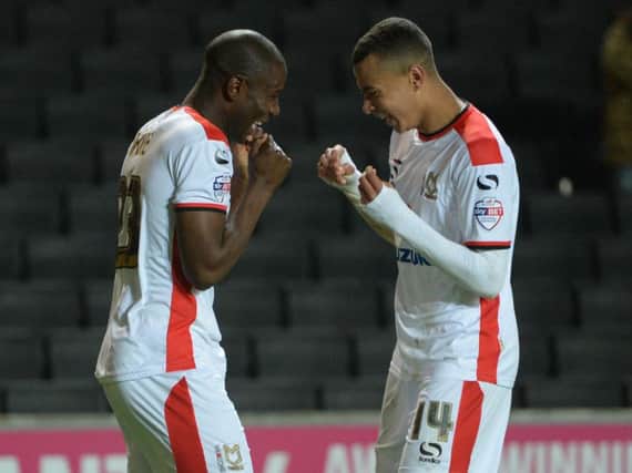 Benik Afobe and Dele Alli celebrate Afobe's goal from the spot against Fleetwood in 2014.