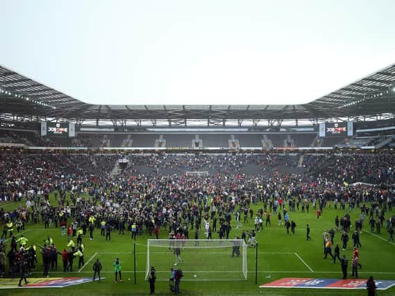 Fans invade the pitch after the Sky Bet League Two match between Milton Keynes Dons and Mansfield Town at Stadium mk on May 04, 2019 in Milton Keynes, United Kingdom. (Photo by Bryn Lennon/Getty Images)