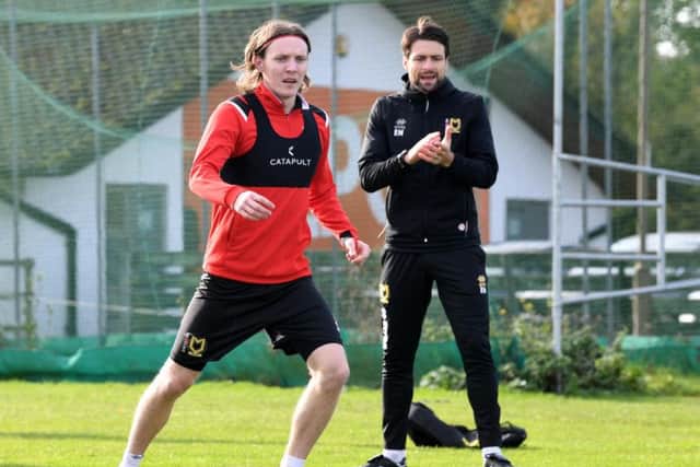 Mason in training, with Russell Martin watching on