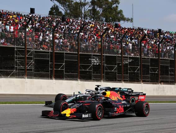 Max Verstappen holds off Lewis Hamilton