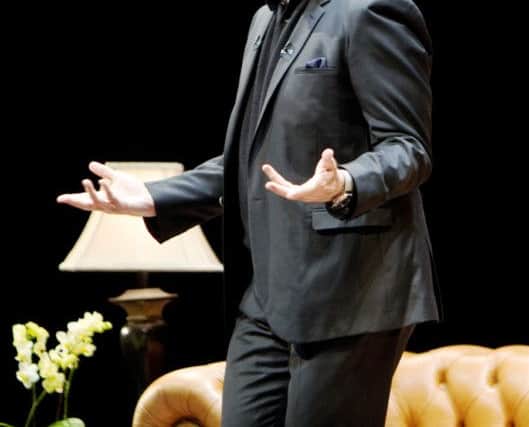 John Travolta in conversation..Photo supplied by WENN