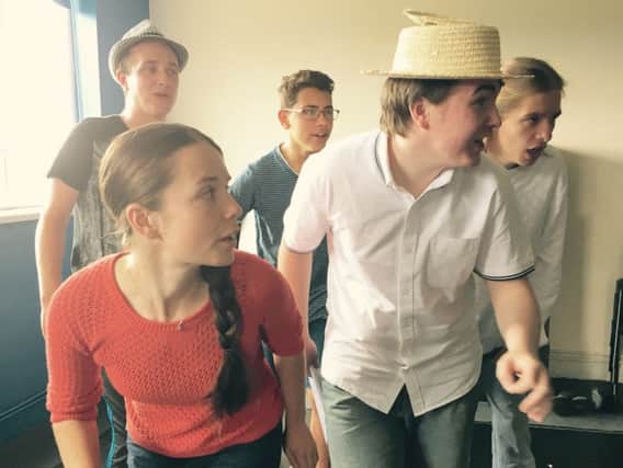 Some of the cast in rehearsals