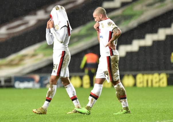 Samir Carruthers and Josh Murphy trudge off after 5-0 thumping by Burnley.