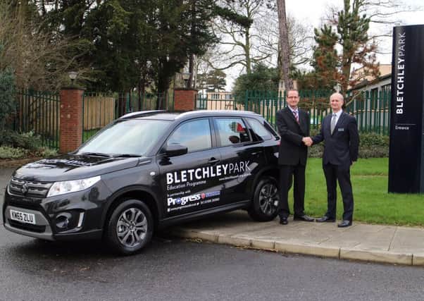 Matt Crathorn (Brand Manager of Progress Suzuki) and Iain Standen (Chief Executive Officer of the Bletchley Park Trust).