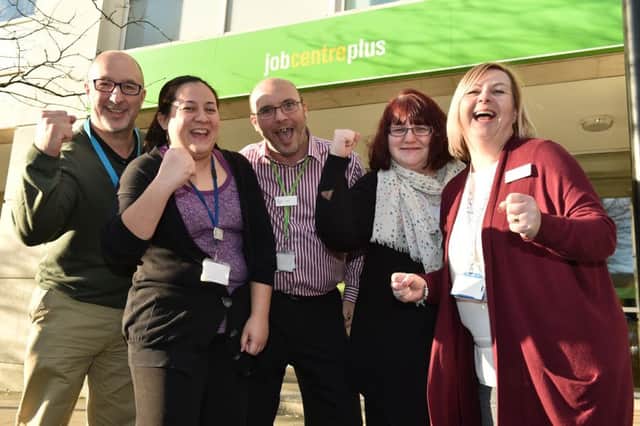 Jubilant: City Jobcentre staff celebrate a record-breaking rise in employment in Milton Keynes.
