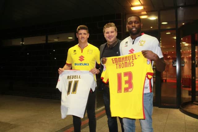 Alex Revell and Jay Emmanuel-Thomas with MK Dons boss Karl Robinson PNL-160102-222734002