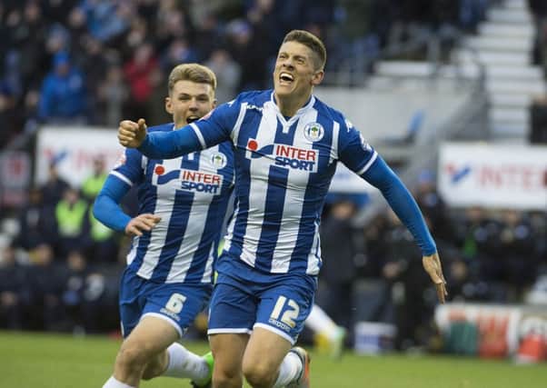 Alex Revell scoring while on loan at Wigan earlier this season.
