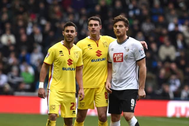 MK Dons defender George Baldock, MK Dons midfielder Darren Potter   and Derby County striker Chris Martin during the Sky Bet Championship match between Derby County and Milton Keynes Dons at the iPro Stadium, Derby, England on 13 February 2016. Photo by Jon Hobley. PNL-160213-165012002