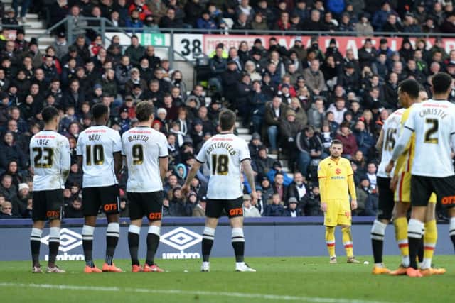 MK Dons forward Jake Forster-Caskey lines up his 82nd free kick which he scores from putting the Dons 1-0 up during the Sky Bet Championship match between Derby County and Milton Keynes Dons at the iPro Stadium, Derby, England on 13 February 2016. Photo by Jon Hobley. PNL-160213-175826002
