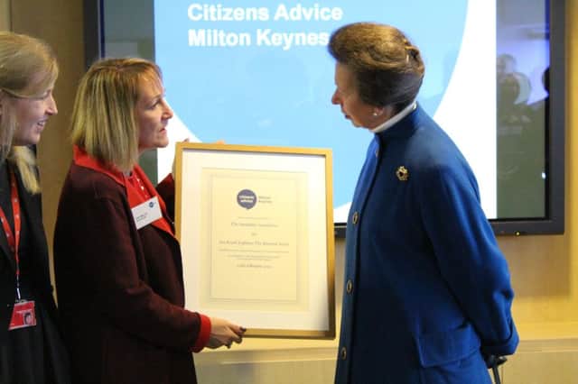 Princess Anne presents Santander's Sue Willis, Managing Director Customer Experience & Complaints with certificate to highlight the fundraising support that the banking group has given to MK CAB.
