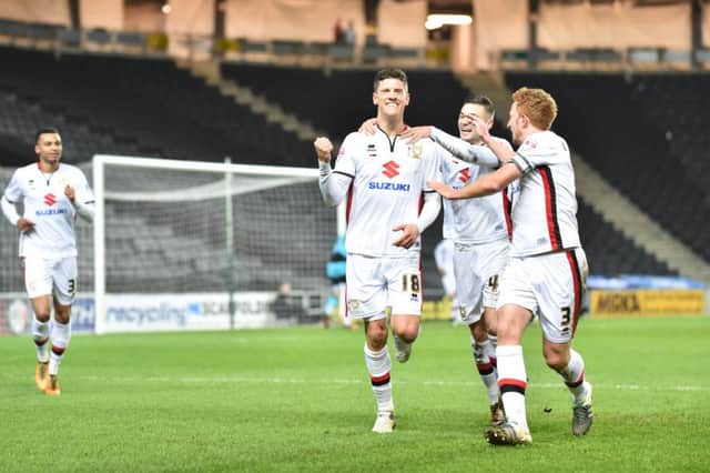 Alex Revell celebrates his goal against Huddersfield