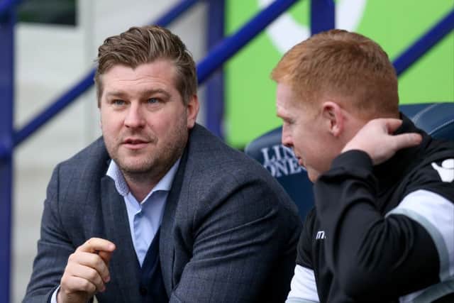 MK Dons manager Karl Robinson and Bolton Wanderers First Team Manager Neil Lennon during the Sky Bet Championship match between Bolton Wanderers and Milton Keynes Dons at the Macron Stadium, Bolton, England on 23 January 2016. Photo by Simon Davies. PSI-1453-0008