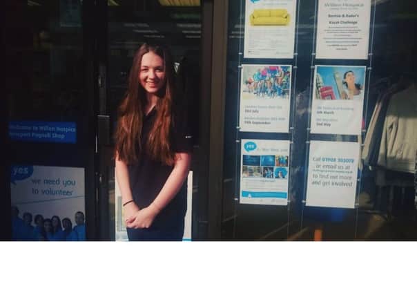 Morgan Piper outside Willen Hospice's Newport Pagnell shop on her first day of volunteering.